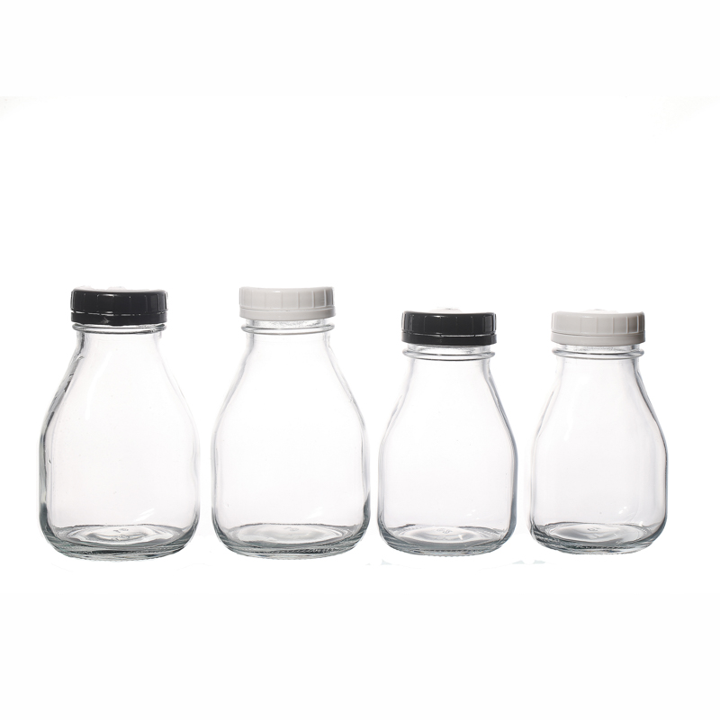 Vente chaude de bouteilles de jus de bouteilles de lait 350ml vides en verre avec des couvercles en plastique